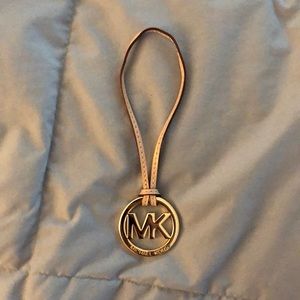 Gold & beige Michael Kors bag tag